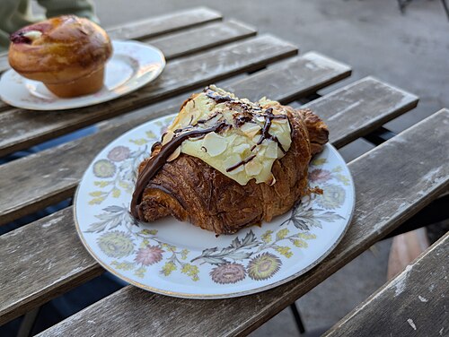 Chocolate and almond croissant on a patterned plate (CC0, Andy Li)